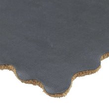 Coir doormat underside with dark backing and scalloped edge trim