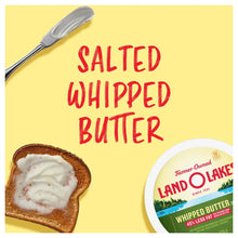 Salted whipped butter tub beside toast with white spread