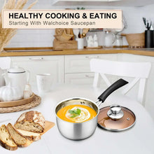 Stainless steel saucepan with transparent lid and black handle, filled with sauce