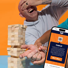 Wooden tower blocks with a smartphone showing the game screen during play