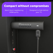 Compact Roku streaming stick with power connector and short HDMI cable