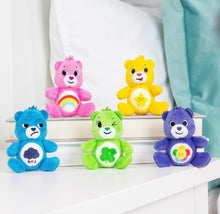 Micro plush Care Bears set with five seated bears on a ledge