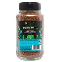 Instant coffee jar with black lid and brown granules, back panel label visible