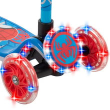 Front-wheel close-up of blue scooter with red glowing light rings