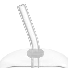 Clear dome lid and tall straw on a straight-sided glass tumbler