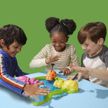 Hungry Hungry Hippos board game with blue, pink, orange, and yellow hippos and marbles