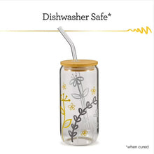 Medium tip metallic paint pen writing on a decorated drink tumbler with straw