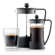 Set of French press coffee makers: glass carafes with black bases and plungers