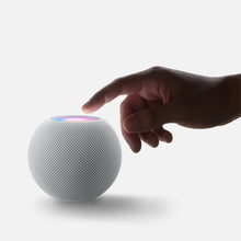HomePod mini smart speaker in light gray/white with blue glowing light ring