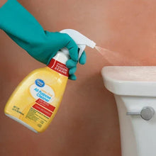 Gloved hand spraying lemon-scent multi-purpose cleaner onto a countertop