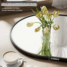 Arched mirror frame close-up with black rim and smooth aluminum edge detail