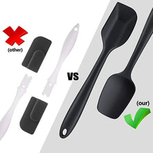 Black silicone spatula with flexible head and loop handle; comparison tool view.