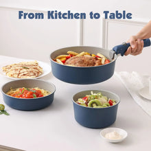 Navy blue ceramic nonstick pots set on a kitchen counter with detachable handle