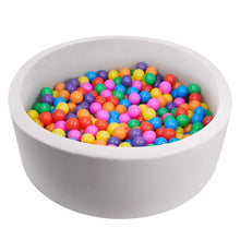 Gray foam ball pit filled with multicolor plastic balls, top view