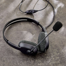 Black stereo headset with boom microphone and inline control module on cord