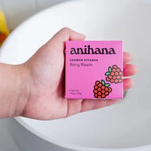Hand holding anihana shower steamer box labeled Berry Ripple