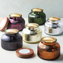 Ribbed glass jar candles with wooden lids in multiple colors