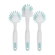Three kitchen dish brushes with teal bristle pads on white handles, front view