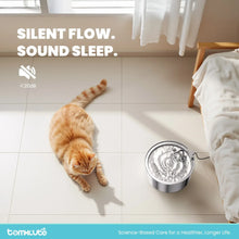 Stainless steel pet water fountain with circular top on tiled floor