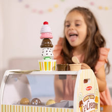Wooden ice cream counter playset with pretend cone and scoop accessories on the counter
