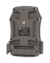 Back of a gray trail camera with label plate and mounting screws