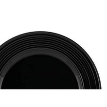 Close-up of black bowl rim with concentric ridged bands