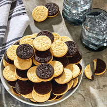 Assorted sandwich cookies with dark and vanilla creme, on a white plate