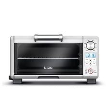 Stainless steel mini toaster oven with dark glass door and front control panel