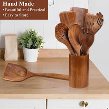Wooden cooking utensils set in cylindrical holder, assorted spoon and spatula pieces.