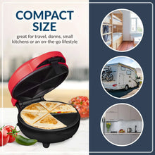 Red and black compact taco quesadilla maker with open plates and visible fillings