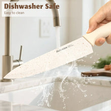 Kitchen knife with white handle and speckled blade under running water in sink