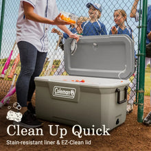 Coleman hard chest cooler with open lid and drain spout on front panel