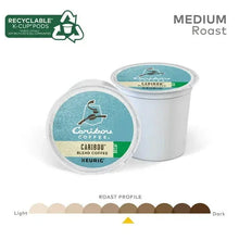 Two Caribou Blend decaf K-Cup pods with medium roast roast-profile scale