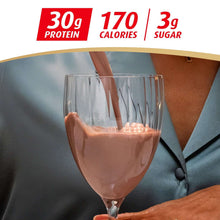 Chocolate-covered strawberry protein shake in a glass, 30g protein label