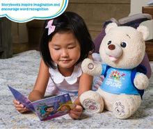 Plush storytelling bear beside a child reading an illustrated storybook