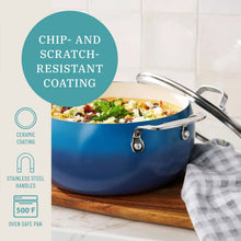 Denim blue ceramic nonstick stock pot with lid, stainless handles, and cooking contents