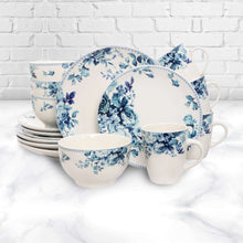 Traditional dinnerware set with blue rose floral plates and stacked mugs