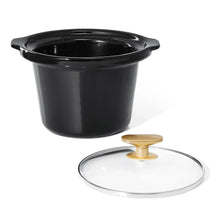 Manual slow cooker with dark pot and clear glass lid, gold knob