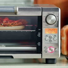 Toaster oven control panel with temperature dial and digital time display