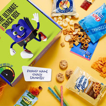 Snack box with I AM Snacky character on lid, snacks scattered around