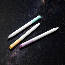 Three gel pens with white barrels and mint, yellow, and purple accents