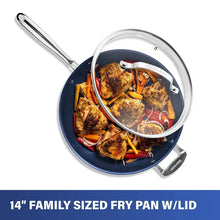 Blue nonstick frying pan with glass lid and visible cooked food