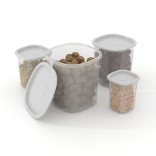 Assorted clear plastic food storage canisters with white snap-on lids