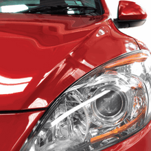 Car headlight and front fender with glossy red paint