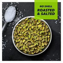 Roasted and salted pistachios in a bowl with visible salt crystals