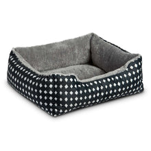 Plush pet bed with black diamond pattern sides and gray fuzzy inner lining