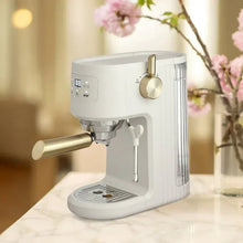 Sand white mini espresso machine with steam wand and gold portafilter handle