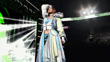 Wrestler in long light-blue coat and black hat raising arm