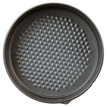 Round nonstick springform pan bottom with raised dot texture for easy release