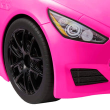 Bright pink toy car front with black wheel and clear headlight housing